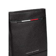 Black leather Tommy Hilfiger wallet displayed with matching crossbody bag