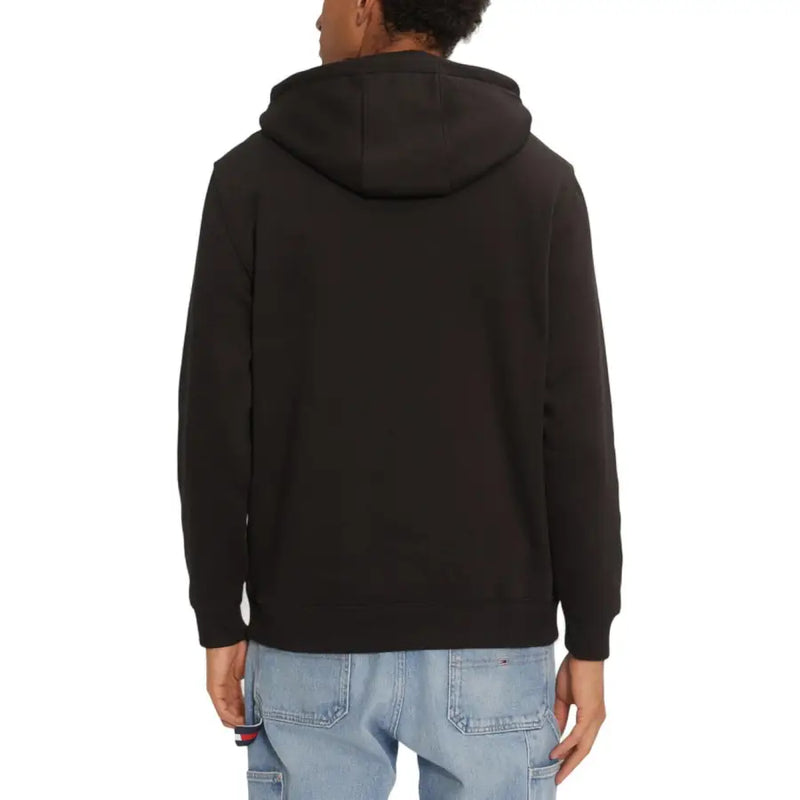 Black long hooded Tommy Hilfiger jeans sweatshirt for men with soft fleece texture and ribbed cuffs for fall winter