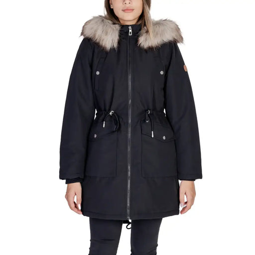 Black long hooded women’s winter jacket with plush light brown fur-lined hood silver-toned zipper accents and pockets