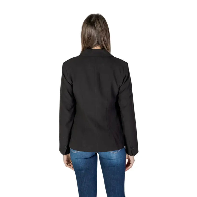 Black long sleeve blazer for women with lapel collar, front pockets, classic tailored fit, and subtle stitching details