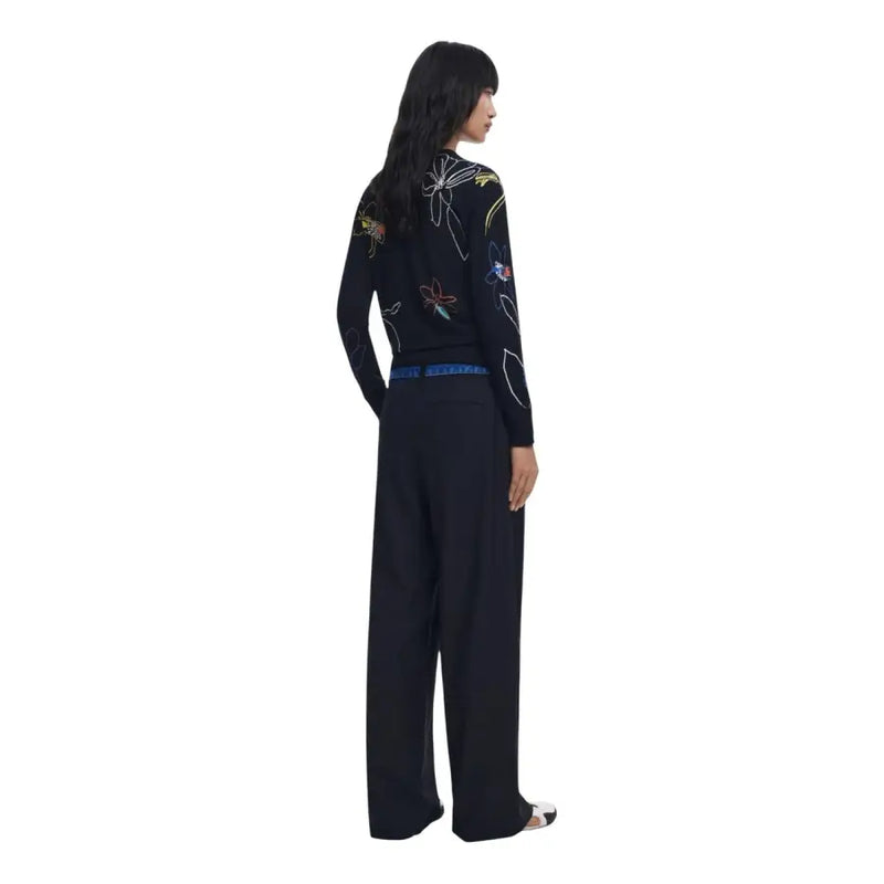 Black long-sleeve top with colorful floral embroidery paired with Desigual Women Trousers in Black