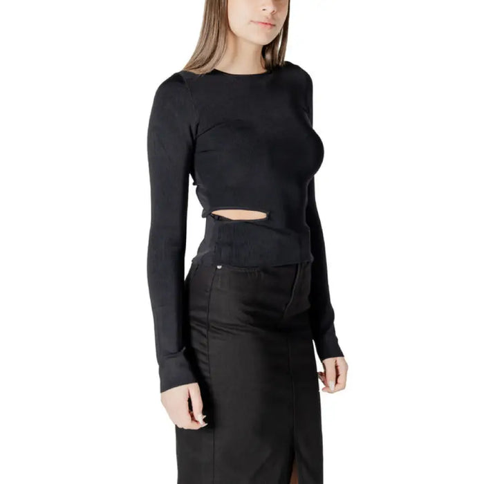 Black long-sleeved cutout top from Black Long Sleeve Cutout Ensemble