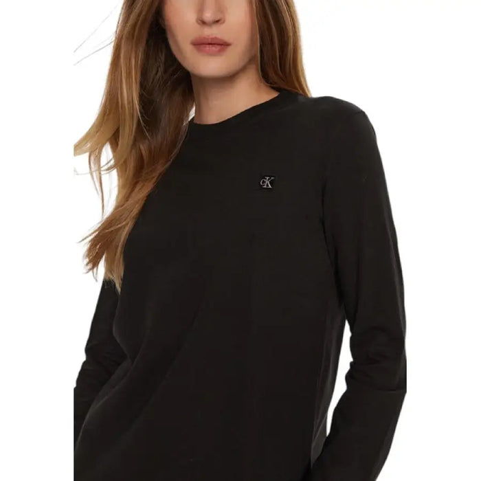 Black long-sleeved shirt displayed in product listing for men’s fashion