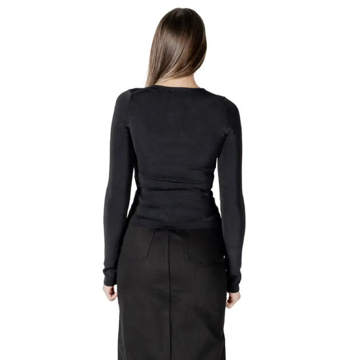 Black long-sleeved top and skirt from the Black Long Sleeve Cutout Ensemble collection