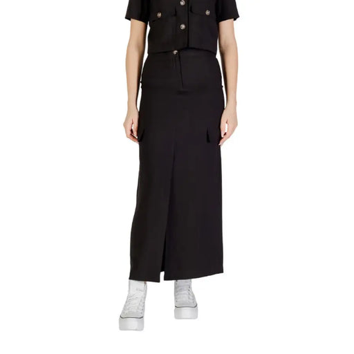 Elegant black maxi skirt with front slit, perfect for stylish formal and casual wear