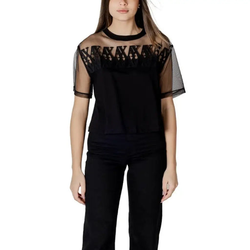 Black mesh overlay two-piece set featuring a top and pants for fashionable streetwear style