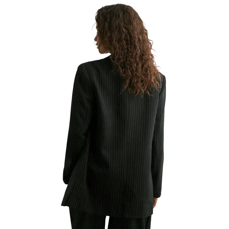 Black pinstripe blazer with lapel collar pockets relaxed fit and long sleeves for formal and casual wear
