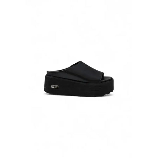 Black platform sandal showcasing stylish designer footwear for women
