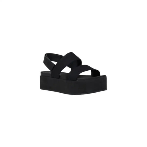 Elegant black platform sandal displayed as part of a stylish women’s footwear collection