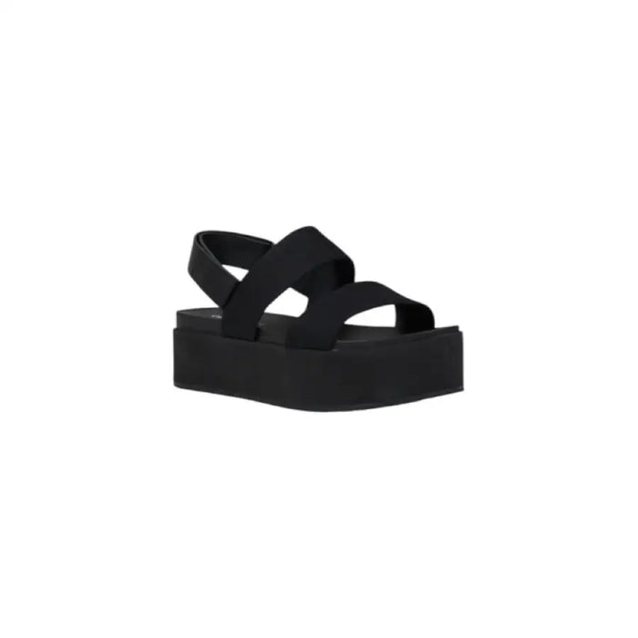 Elegant black platform sandal displayed as part of a stylish women’s footwear collection