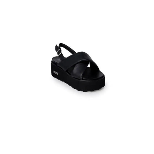 Black platform sandal displayed in a stylish footwear product image