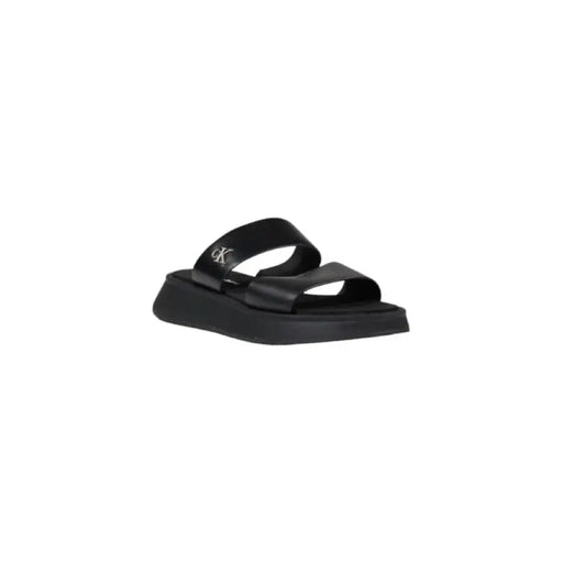 Black platform slide sandal showcasing a stylish and comfortable footwear option