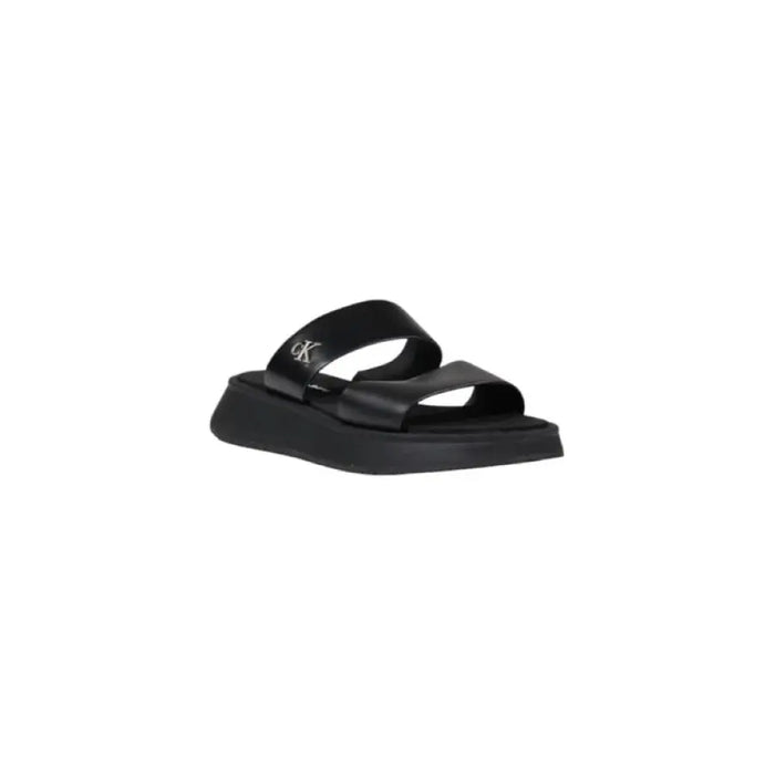 Black platform slide sandal showcasing a stylish and comfortable footwear option
