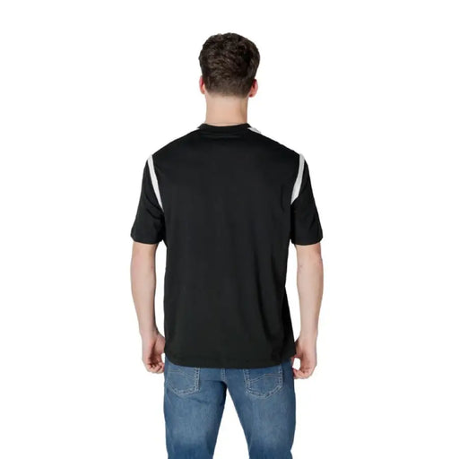 Black polo shirt with white shoulder stripes from Armani Exchange Men’s collection