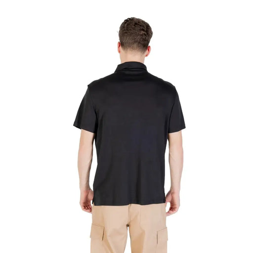 Black short sleeve polo shirt displayed as a stylish men’s clothing item