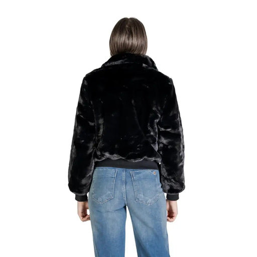 Black faux fur bomber jacket for women with plush textured surface ribbed cuffs and zippered pockets