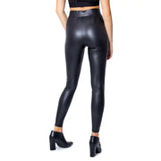Black high-waisted faux leather leggings with a sleek shiny finish made of polyester elastane for fall and winter