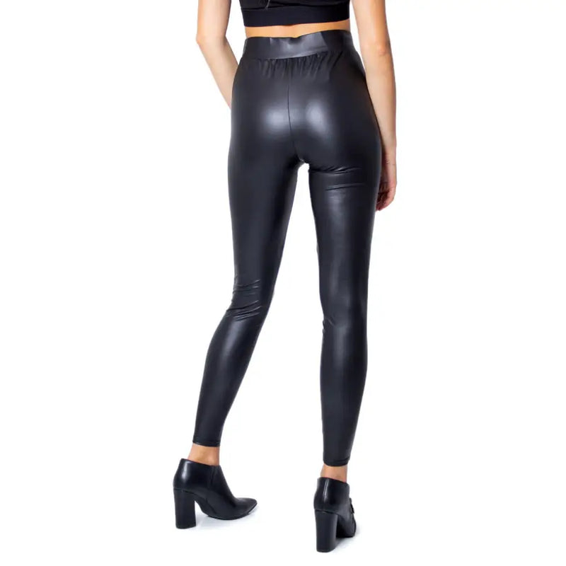 Black high-waisted faux leather leggings with a sleek shiny finish made of polyester elastane for fall and winter