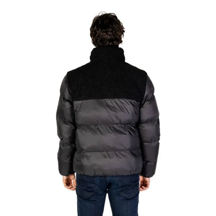 Black puffer jacket designed for warmth and style during cold weather