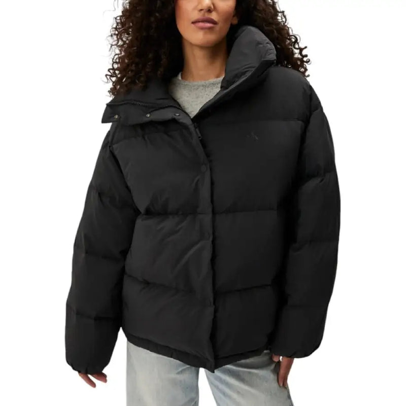 Black Puffer Jacket displayed in the Olive Green Puffer Jacket product image