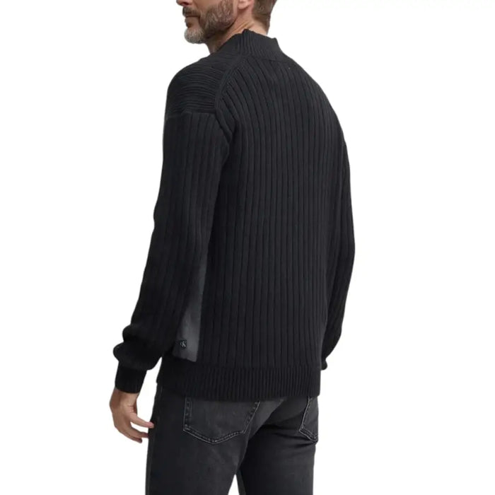 Black ribbed knit sweater for men displayed in a product image
