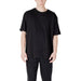 Black short-sleeved T shirt displayed on Man in Light Colored T Shirt and Black Pants