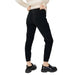 Black skinny jeans paired with chunky black sneakers from Hanny Deep Women Trousers