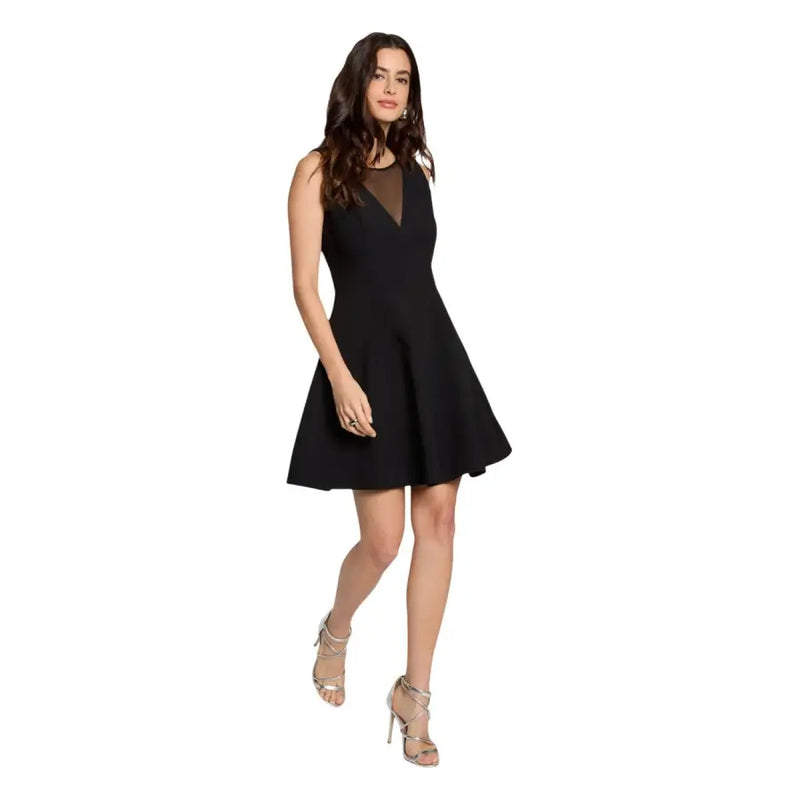 Black sleeveless dress by Morgan De Toi featuring a sheer mesh neckline and a flared skirt