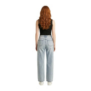 Light-wash denim jeans with high-rise waist and straight-leg cut paired with black sleeveless zip cardigan for women