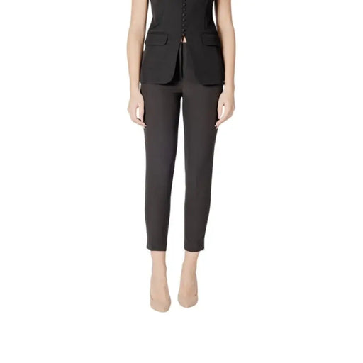 Black slim-fit trousers showcasing a modern and stylish design for versatile wear