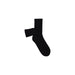 Black Guess sock with white logo and tag displayed in a product image