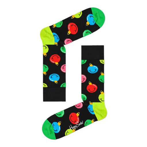 Black socks adorned with colorful smiley faces in a Gingerbread House box