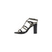 Black studded heeled sandal displayed on a product page