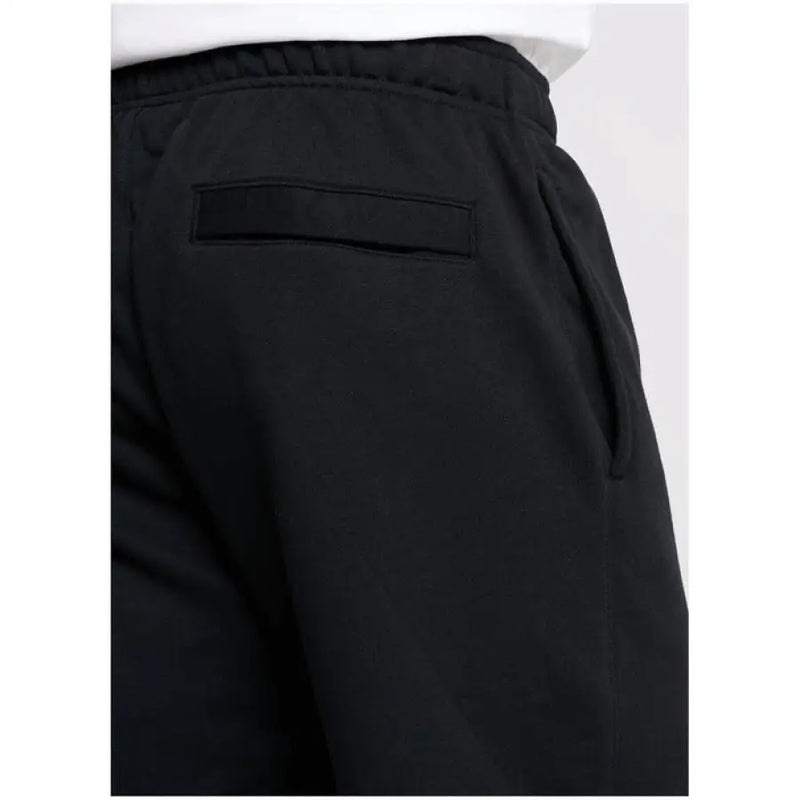 Black Nike Men All Seasons Trousers featuring a back pocket for enhanced utility