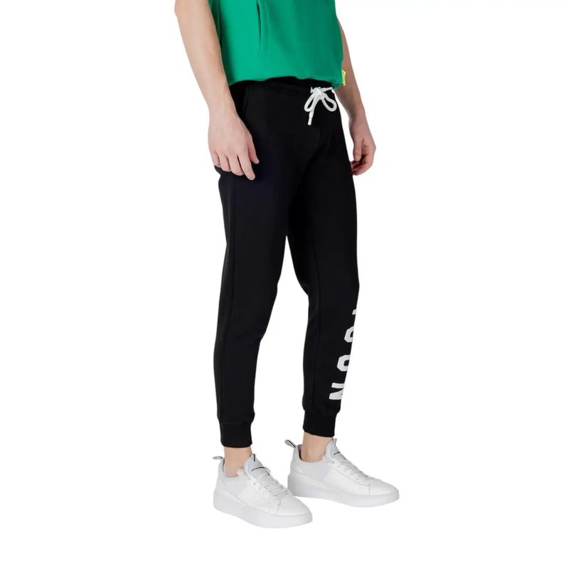 Black sweatpants with white drawstring featuring vertical lettering on the side made of comfortable jogger material