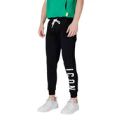 Black sweatpants with white drawstring featuring vertical icon lettering on the side made from comfortable fabric