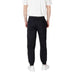 Black sweatpants paired with white sneakers displayed in a product image
