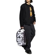 Black and white graphic backpack with bold diesel lettering featured with black sweatshirts from Diesel collection