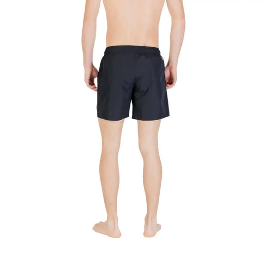 Black swim trunks displayed on a product page for men’s beachwear