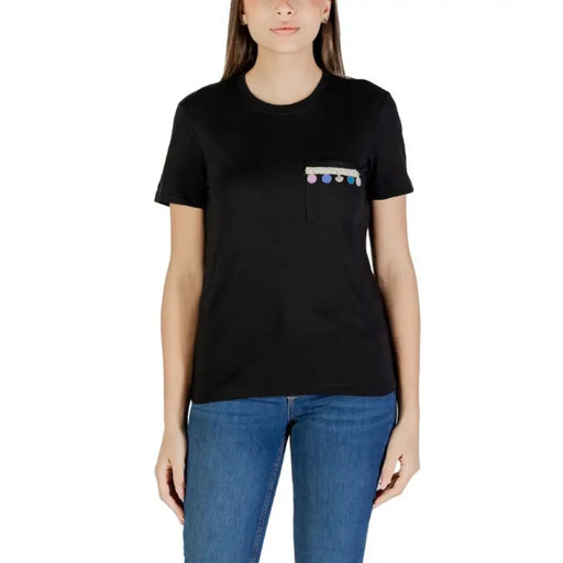 Black T shirt with decorated pocket displayed for stylish men’s casual wear