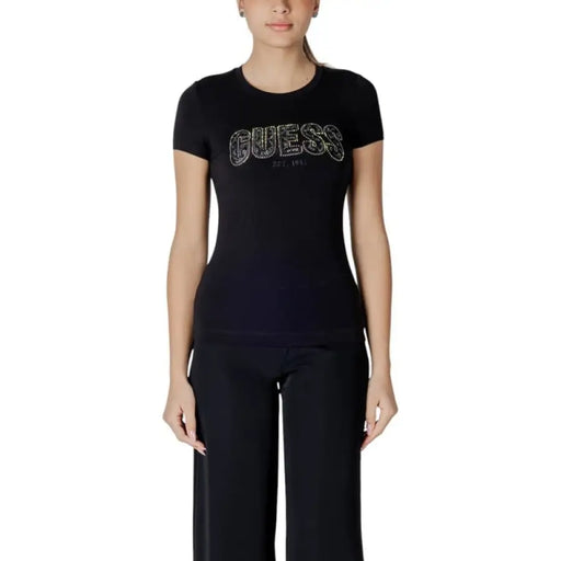 Black T shirt featuring Guess logo displayed on a product with the same name