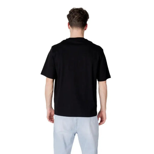 Black T-shirt and light blue pants from Armani Exchange for men, made of 100 percent cotton