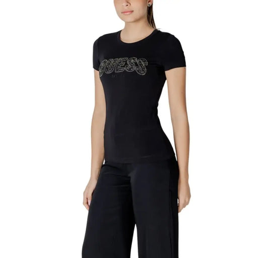 Black T shirt featuring rhinestone Guess logo for stylish casual wear