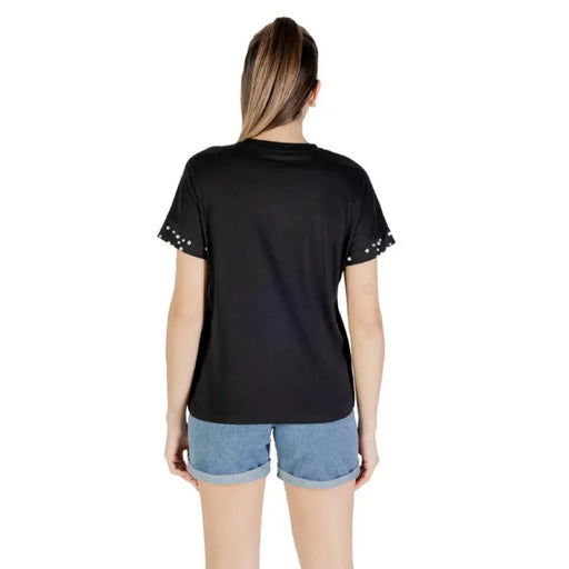Black T shirt with studded sleeves showcasing a stylish casual fashion item