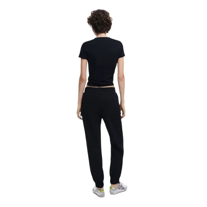 Black T-shirt and sweatpants outfit featuring Light Blue Denim Jogger Pants with Black Side Stripes