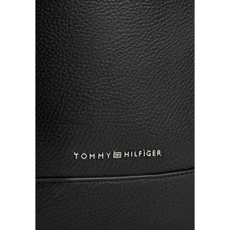 Black textured leather sling bag from Tommy Hilfiger for a stylish and sophisticated look