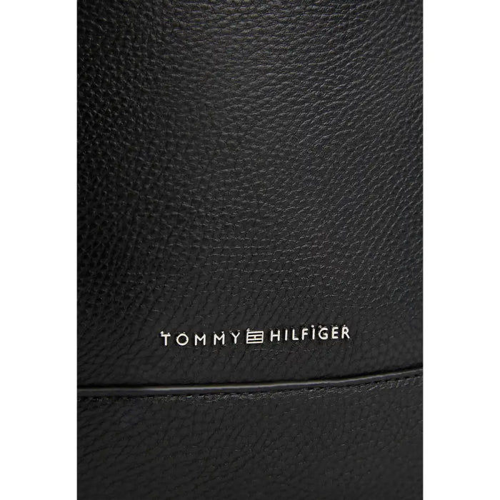 Black textured leather sling bag from Tommy Hilfiger for a stylish and sophisticated look