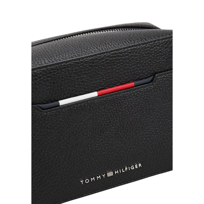 Black textured leather toiletries bag by Tommy Hilfiger for stylish storage