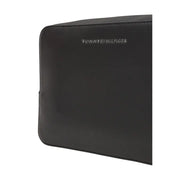 Black Tommy Hilfiger bag with zippered pouch and wristlet for stylish organization