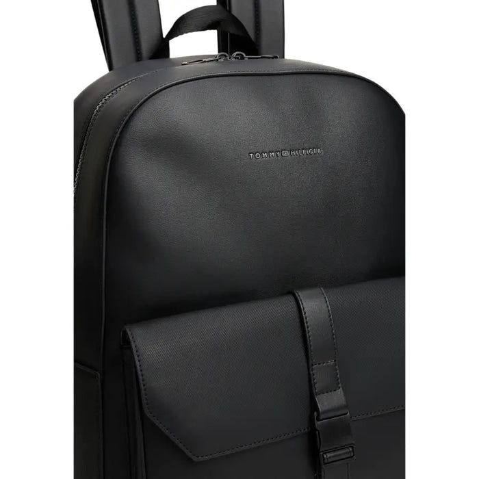 Black Tommy Hilfiger leather backpack displayed in a product showcase